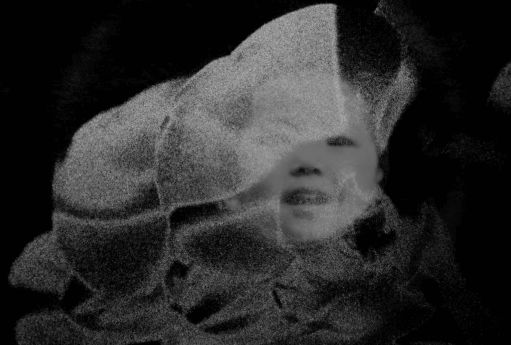 Experimental black-and-white image of an Asian child's face.